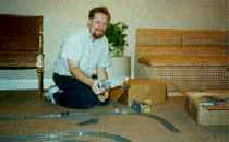 Stephen F. Roberts lays track.